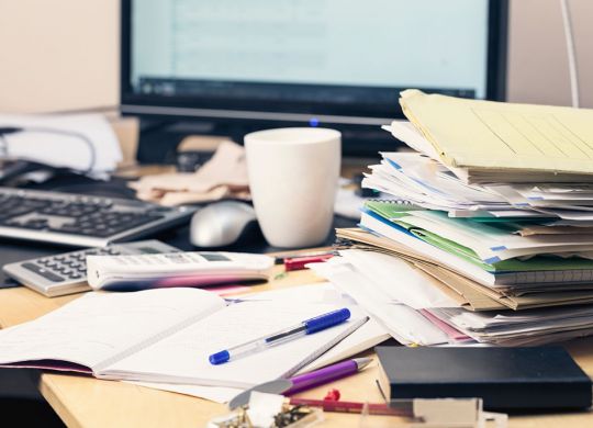cluttered desktop with folders and office documents